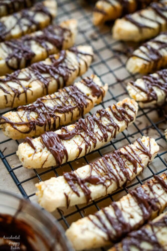 A batch of Chocolate Almond Biscotti drying on a cooling rack. 