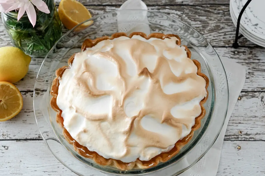This Lemon Meringue Pie looks normal on the outside, but is hiding a rainbow on the inside. 