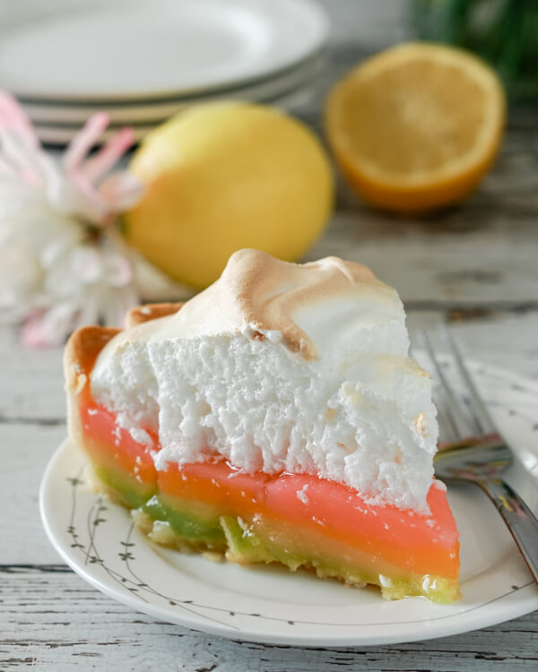 A slice of rainbow colored lemon meringue pie