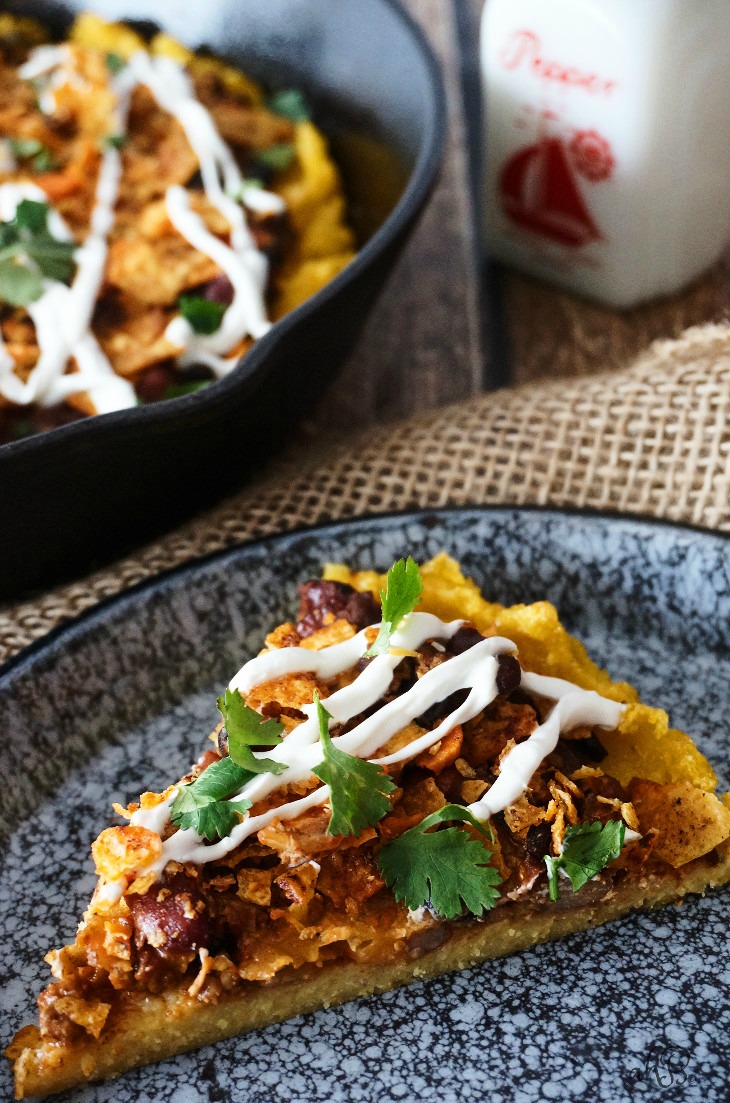 Crispy-edged, creamy-centered polenta topped with chili, cheese, and crunchy crushed nacho chips. No one will ever guess that this chili cheese polenta is a frugal leftover makeover, unless you tell them that is! 