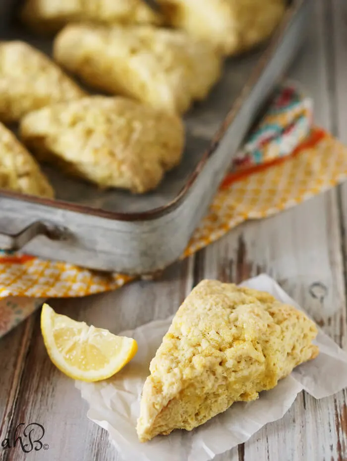 Lemon sugar scones are light and tender, with a delicate and natural lemon flavor. Perfect for nibbling alongside your favorite cup of tea. Recipe on www.accidentalhappybaker.com @AHBamy