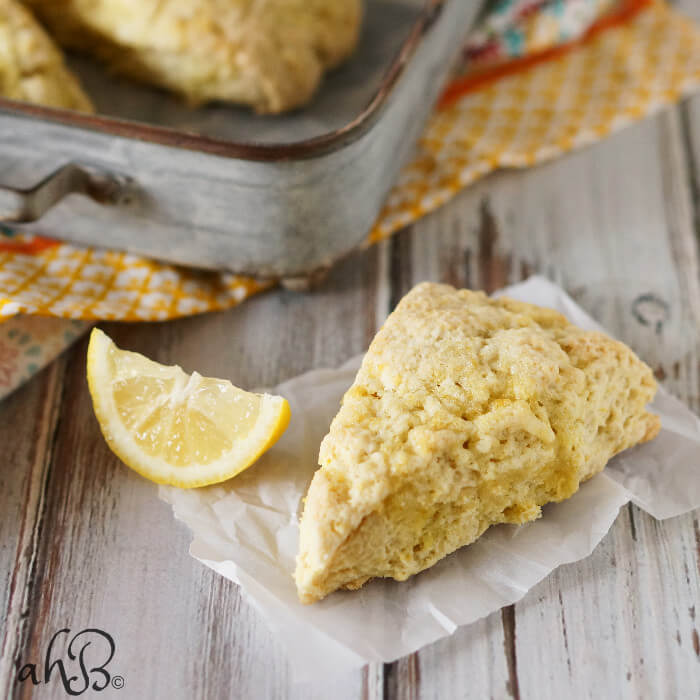 Lemon sugar scones are light and tender, with a delicate and natural lemon flavor. Perfect for nibbling alongside your favorite cup of tea. Recipe on www.accidentalhappybaker.com @AHBamy