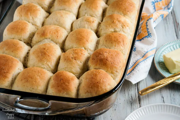 A pan of light and fluffy oatmeal rolls fresh from the oven. 