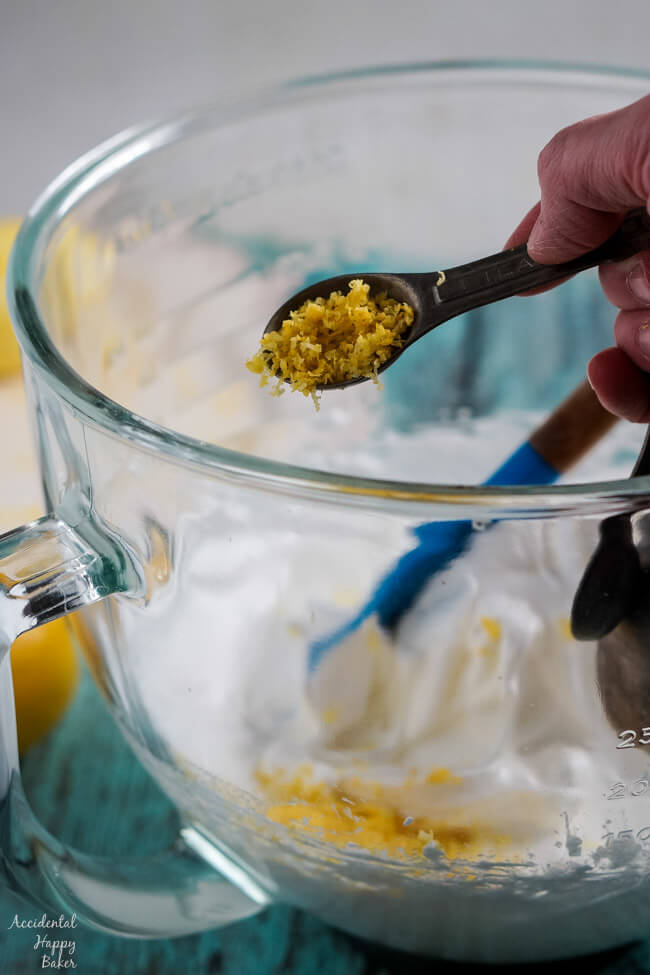 Adding the fresh lemon zest to the batter. 