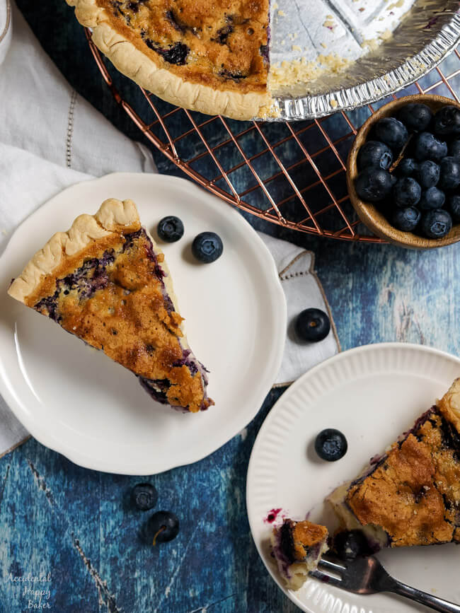 Two slices of blueberry buttermilk pie. 