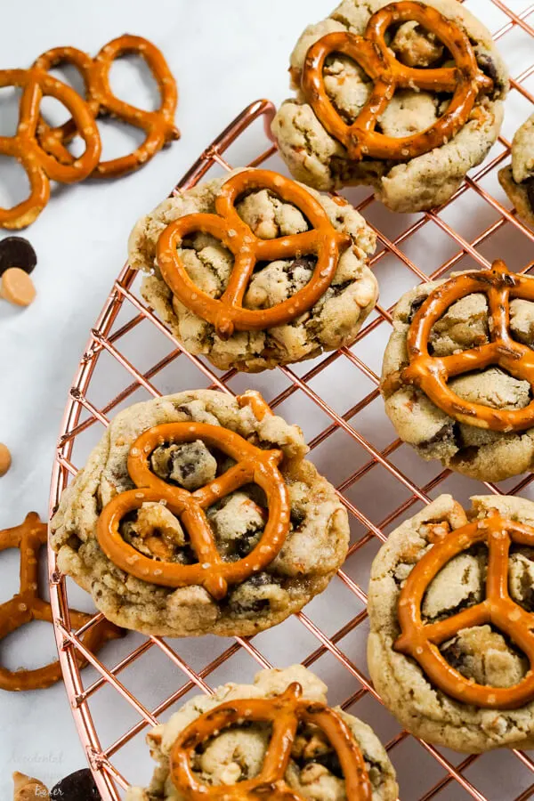 Peanut Butter Pretzel Chocolate Chip Cookies are set out on a cooling rack. 