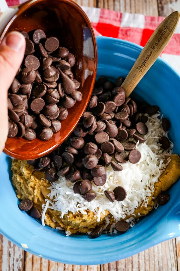 Dark chocolate chips and coconut is added to the cookie dough.
