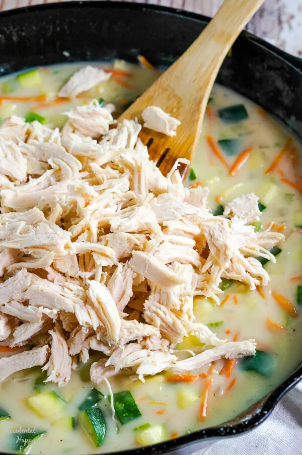 Shredded chicken is added to the skillet with the veggies and homemade cream of chicken soup. 