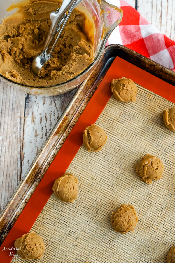 A cookie sheet with mounds of German Gingerbread cookie dough on it. 