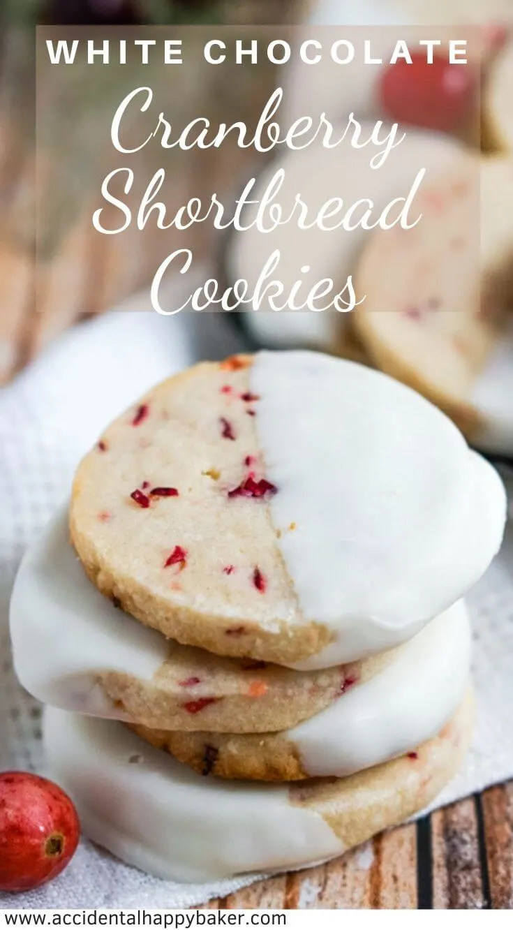 White Chocolate Cranberry Shortbread Cookies have fresh chopped cranberries, a buttery crisp texture, and are dipped in white chocolate. #christmascookies #cranberrycookies #shortbreadcookies