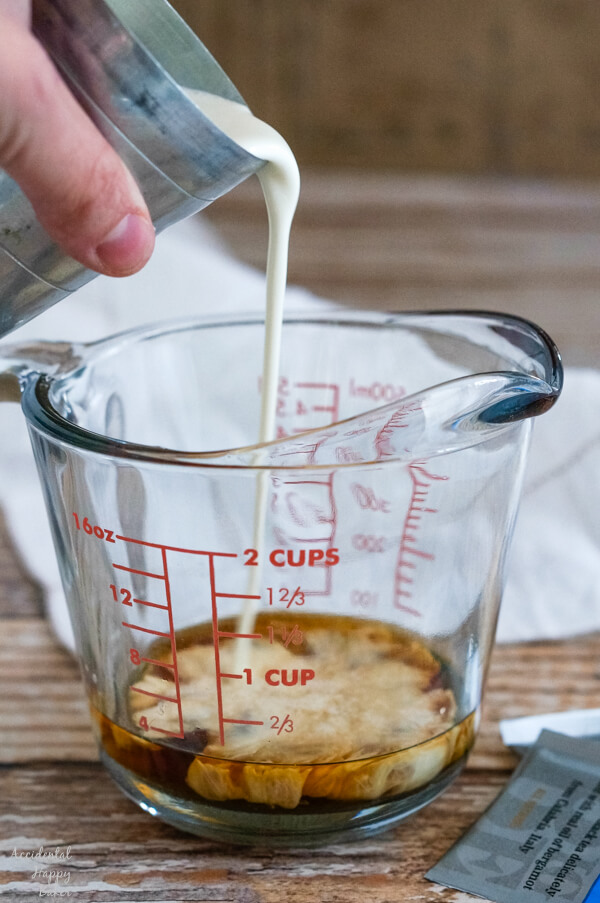 A clear measuring cup of Earl Grey tea. 