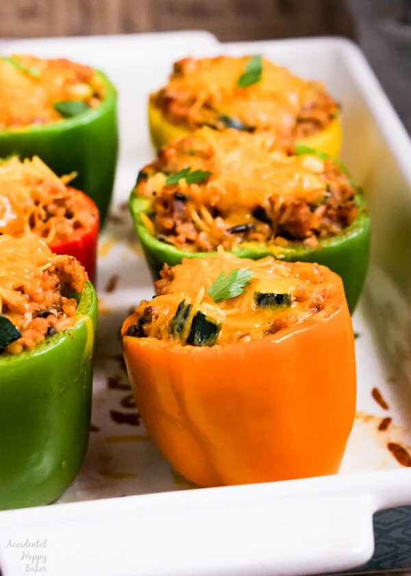  Wild rice stuffed bell peppers take wild rice mix, sausage, bell peppers and veggies and turn it into a colorful and fresh main dish. #stuffedbellpeppers #wildrice #maindishrecipe #accidentalhappybaker