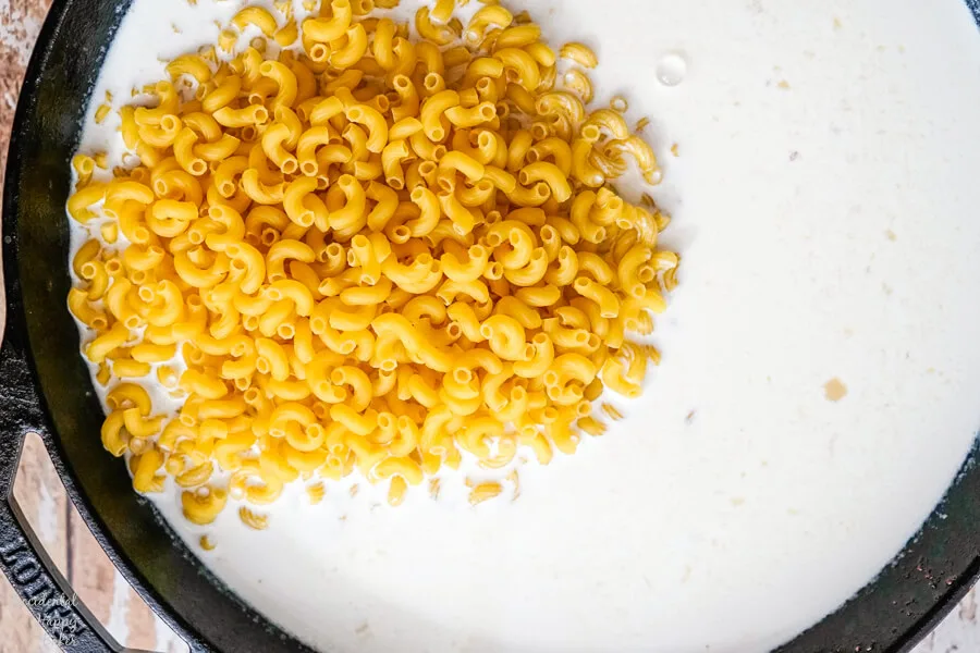 The macaroni is added to the mixture. 