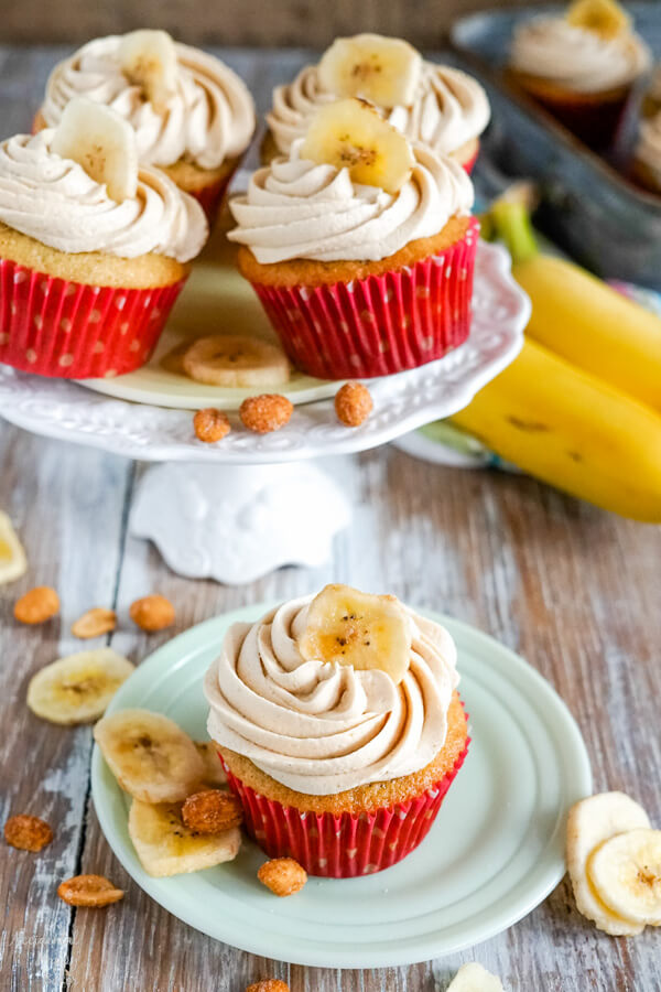 A stand full of peanut butter banana cupcakes with a single cupcake in the front. 