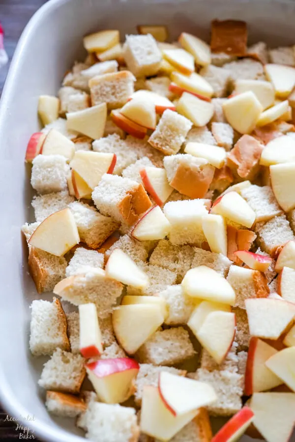 Bread cubes and chopped apples are layered in a 9x13 pan. 