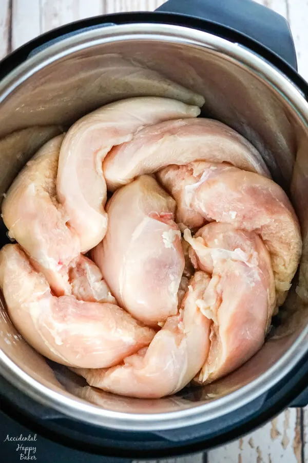 The chicken is placed on it's side in the instant pot to maximize space. 
