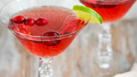 Two crystal glasses of cranberry moscato punch.