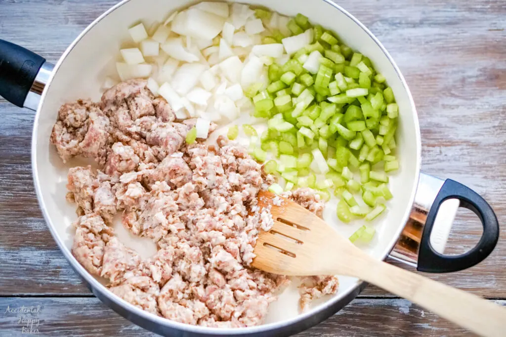 The sausage is browned with the chopped celery and onion. 