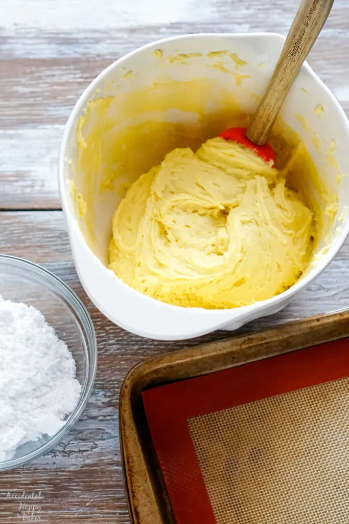 Step one is to combine the lemon cake mix with the butter and eggs. 