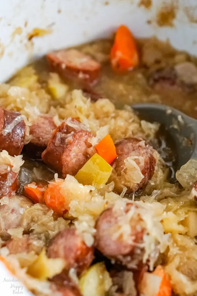 A close up image of the finished kielbasa and sauerkraut after it has finished cooking. 