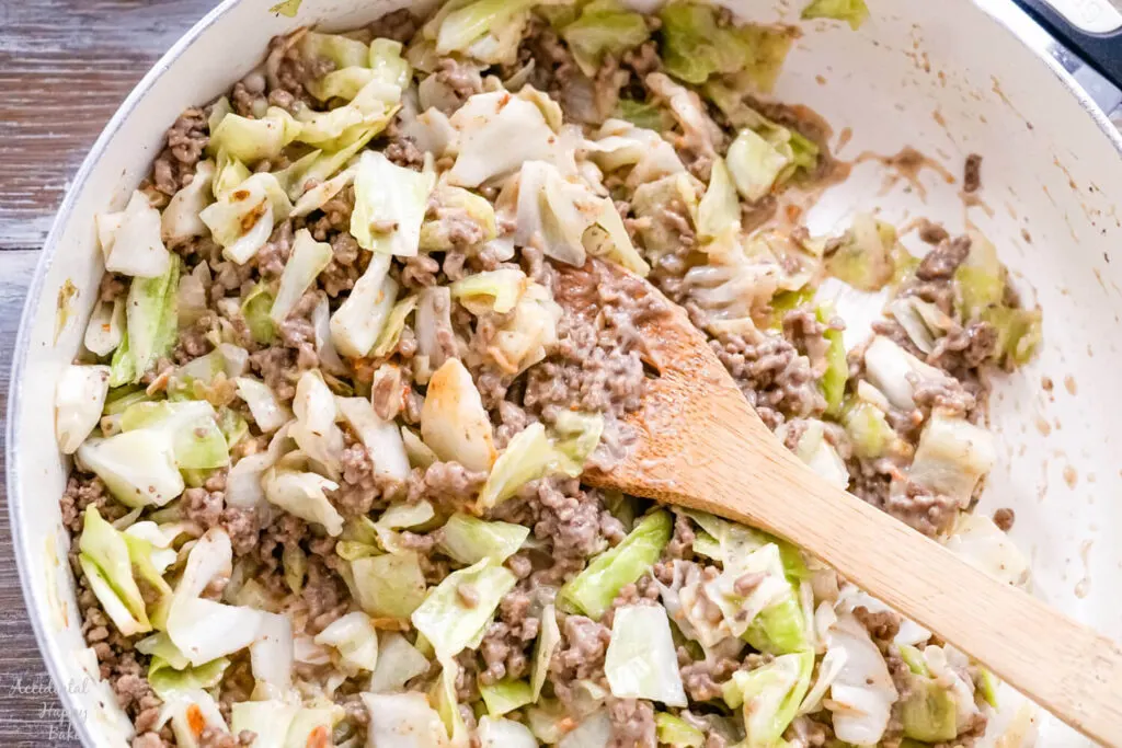 A skillet full of the ground beef and cabbage filling for the Runza casserole. 