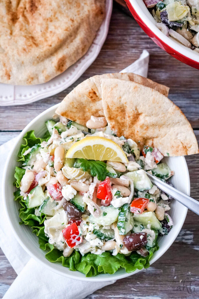 A serving of Mediterranean Tuna Salad with Pitas to one side.