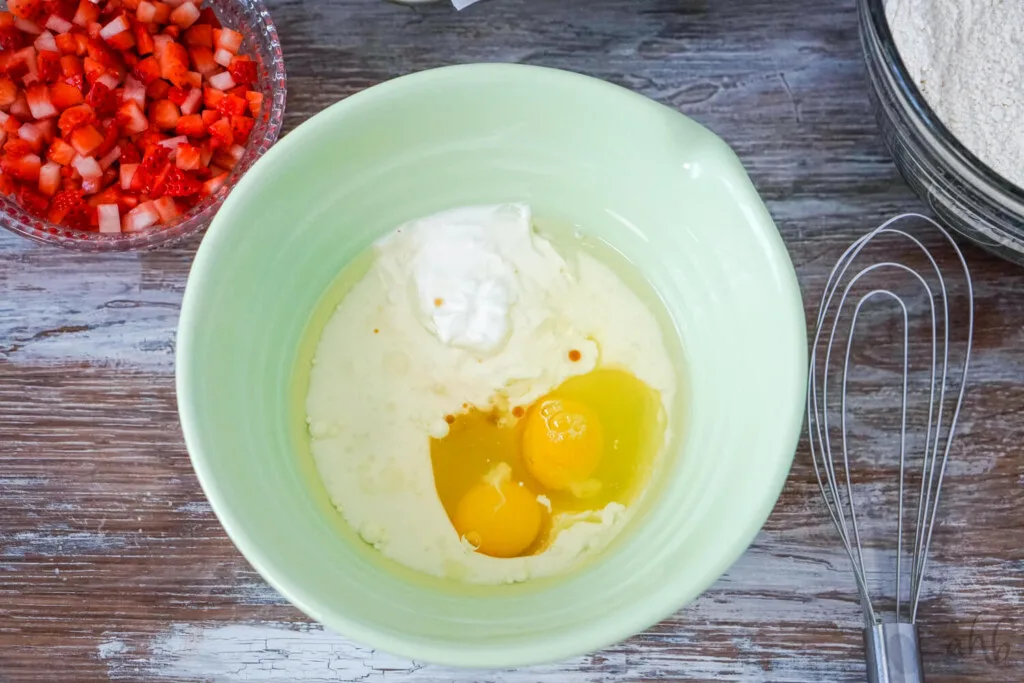 In a separate bowl combine the greek yogurt, buttermilk, vegetable oil,  eggs and vanilla extract. 