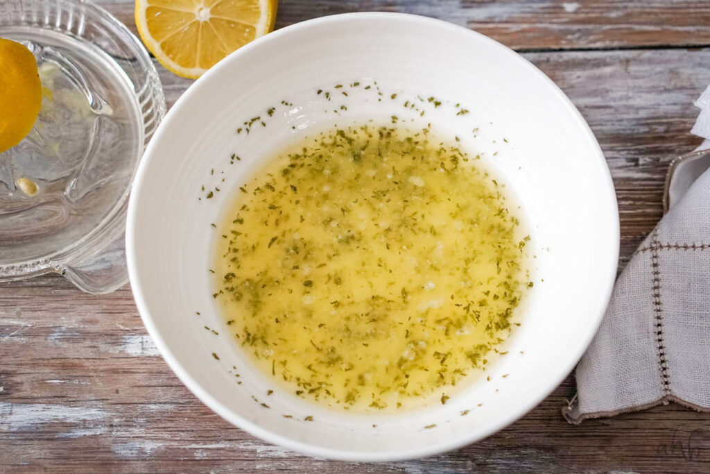 Garlic, melted butter, and parsley are combined to make the butter garlic sauce.