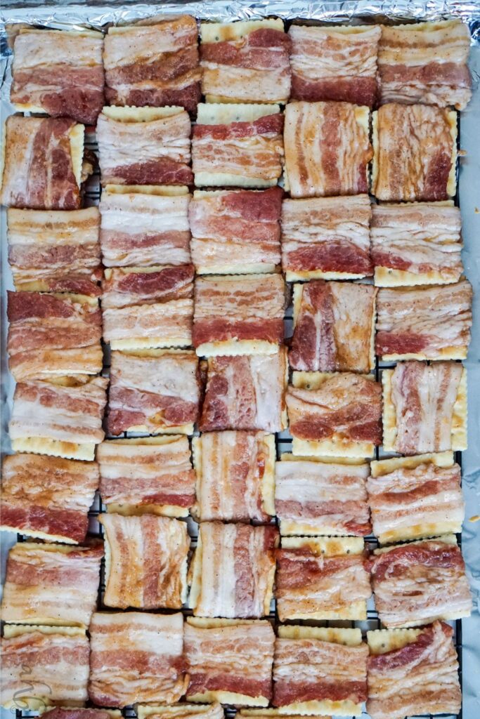 A tray full of uncooked Cajun Bacon Crackers.