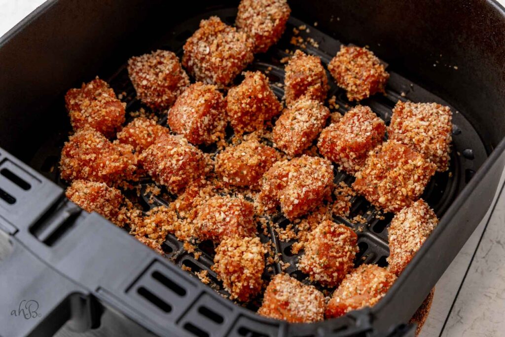 the salmon bites are added to the fryer.